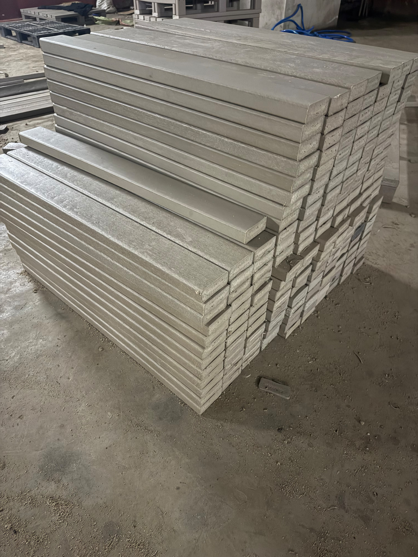 Recycled plastic lumber profiles stacked on the factory floor in Arusha