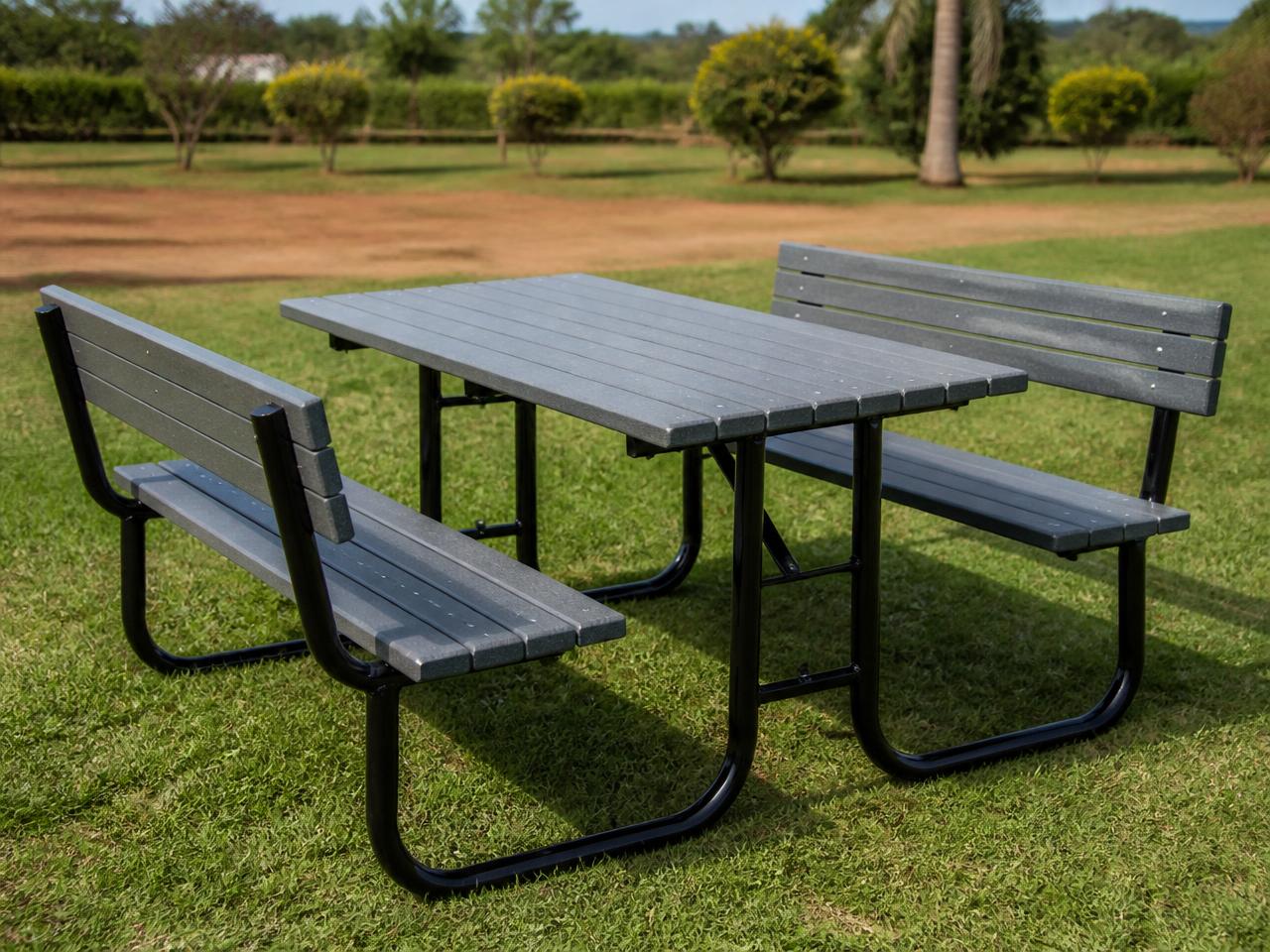 Recycled plastic lumber picnic table and benches on a lawn